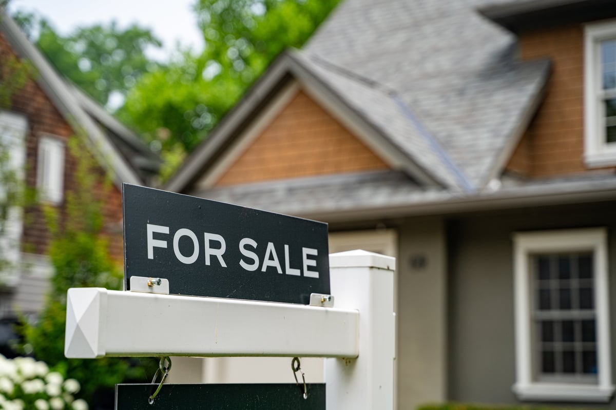 A for sale sign posted in front of a Southwest Florida home