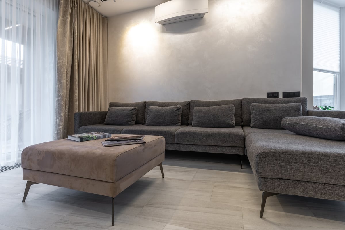 A decluttered, neutral living room prepared for photographs before a home goes on the market